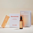 Geschenk-Box EMPOWER von the weeks. Es sind Honest OIl, Momstone sund das Wochenbettposter zu sehen.